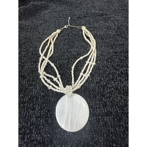white seed bead multi strand necklace with faux pearls and large shell pendant